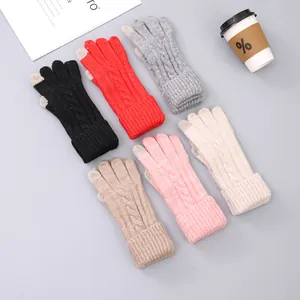 Close-up of knit winter gloves with touchscreen fingertips in various stylish colors