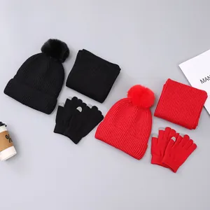 Winter knit set including pompom beanie, neck warmer, and touch-screen gloves in black and red