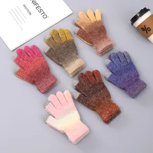 Detail of colorful gradient knit gloves with touchscreen finger tips and ribbed cuffs