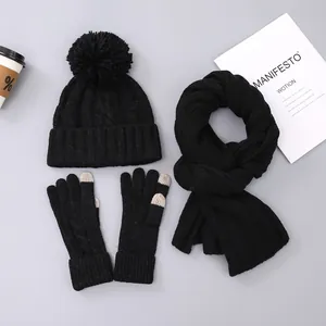 Winter knitted set with pompom beanie, scarf, and touchscreen gloves in classic black