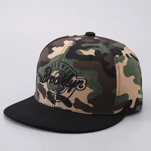 Detailed embroidery of Brooklyn logo on woodland camouflage flat brim snapback hat