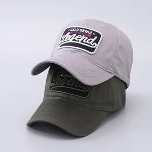Close-up of cotton baseball caps in lavender and olive green with California embroidery