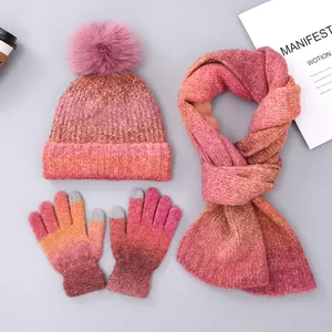 Detailed view of the pink gradient knit texture on the winter hat, scarf, and gloves set