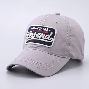 Detail of embroidered California Legend patch on a purple cotton baseball cap