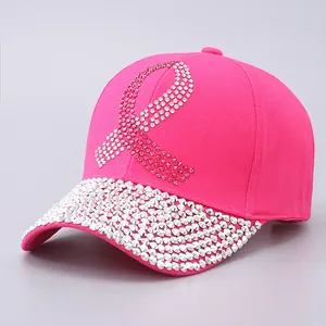 Pink rhinestone baseball cap featuring a ribbon pattern and crystal-embellished brim