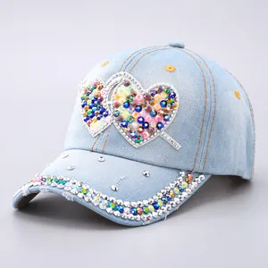 Denim baseball cap with colorful rhinestone hearts and studded brim for women