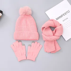 Three-piece winter set with knitted hat, scarf, and touch-screen gloves in soft pink color