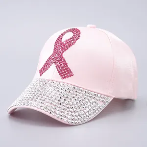 Detailed view of pink satin baseball cap with rhinestone ribbon and studded brim