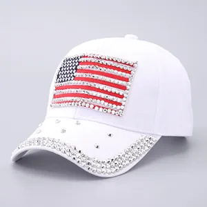 Detail of white USA flag baseball cap with rhinestone embellishments on brim and crown