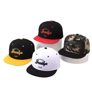Flat brim baseball caps with Brooklyn embroidery in black, camo, yellow, and white colors