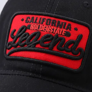Detailed close-up of premium red 'Legend' 3D embroidery on black cotton baseball cap