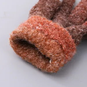 Detailed view of the thick tie-dye knit cuff and textured fabric of the warm winter gloves