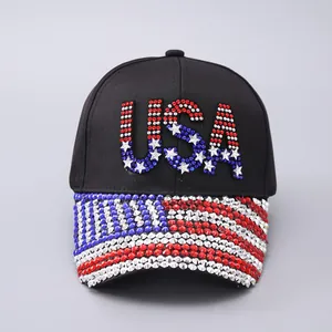 Detail of USA lettering and stars with red white and blue rhinestones on a baseball cap