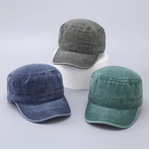 Detailed texture of vintage washed cotton cadet hats in grey, navy and dark green colors