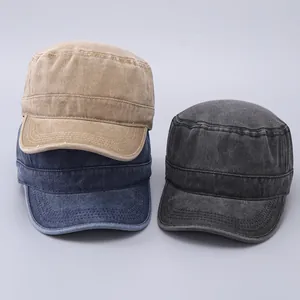 Detailed stack of khaki, navy, and charcoal vintage washed cotton cadet caps in macro view