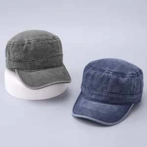 Detail shot of vintage washed cotton cadet caps in dark grey and navy blue colors