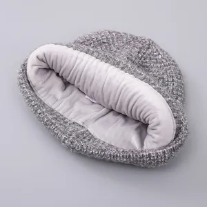 Winter knitted beanie for adults with grey mixed-color yarn and thick warm fleece lining