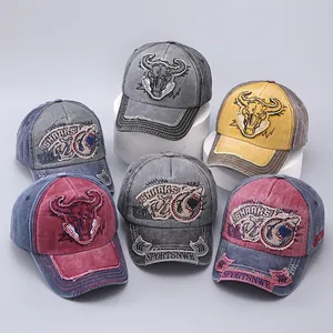 Group of vintage washed cotton baseball caps with animal embroidery and frayed edges