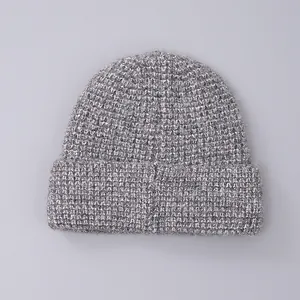 Close-up of chunky marl knit texture on a thick winter beanie with wide folded cuff