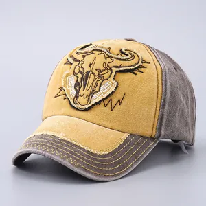 Close-up of vintage washed cotton baseball cap featuring bull skull embroidery detail