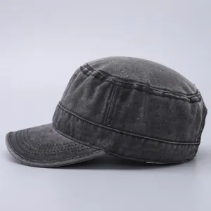 Side view of washed dark grey cotton cadet cap showing reinforced stitching and canvas texture