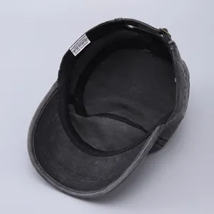 Detail view of cotton army cap interior showing 100% cotton label and metal buckle