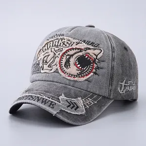 Detail of vintage washed gray cotton baseball cap with shark patch and embroidery
