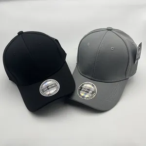 Top view of black and grey baseball caps showing spandex texture and size stickers