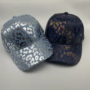 Detailed comparison of light blue silver and dark blue gold metallic leopard baseball caps