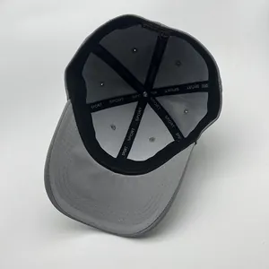 Detail of grey baseball cap interior showing six-panel stitch and SPORT logo seam tape