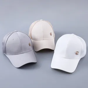 Close-up of breathable mesh baseball caps with G-logo metal emblem in various colors