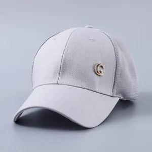 Detail view of breathable grey mesh baseball cap with crystal embellished G logo on side