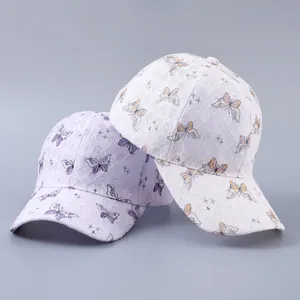 Detailed lace baseball cap with butterfly pattern and rhinestone accents in purple and white