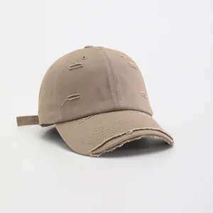 Vintage distressed khaki cotton baseball cap with ripped details and curved brim