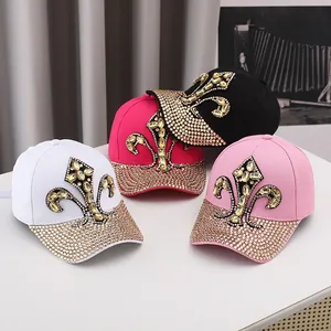 Macro detail of rhinestone baseball caps featuring sparkling gems and floral patterns