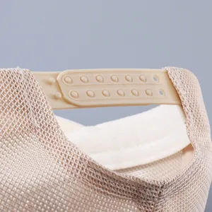Macro detail of the beige mesh baseball cap with adjustable plastic snapback closure