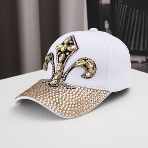 White cotton baseball cap with champagne rhinestone fleur-de-lis and luxury crystal brim
