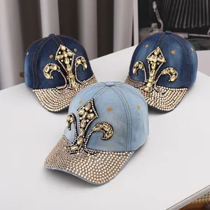 Detailed denim baseball caps featuring luxury rhinestone fleur-de-lis embroidery decoration