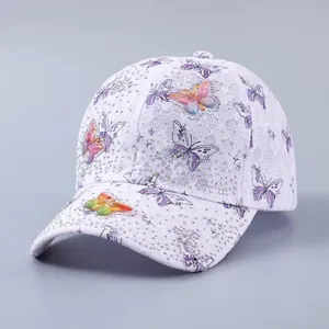 Close-up of lavender lace baseball cap with 3D butterfly appliqués and rhinestones