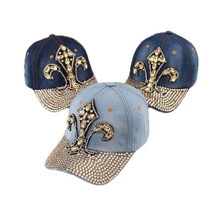 Fashionable denim baseball cap with rhinestone fleur-de-lis and crystal curved brim