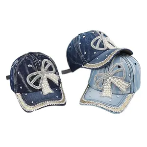 Denim baseball cap with pearl bow and rhinestone details in blue and light blue