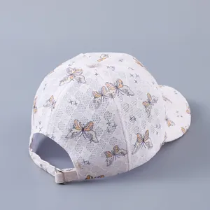 Detail of lace baseball cap with butterfly print and adjustable silver metal buckle