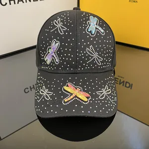 Black baseball cap with colorful rhinestone dragonfly patterns and elegant crystal studs