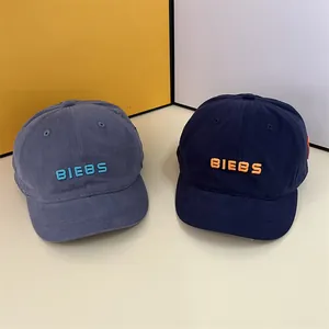 Short brim baseball cap with BIEBS embroidery in navy blue and grey blue colors