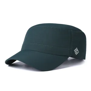 Detail of forest green ripstop fabric and logo on the side of flat top military cap