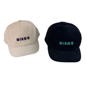 Short brim baseball caps in beige and black with BIEBS 3D embroidery and cotton fabric