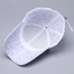 Detail view of the breathable lace lining and adjustable metal buckle on a lavender cap