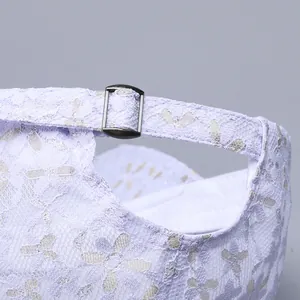 Macro detail of breathable purple lace baseball cap featuring adjustable metal buckle