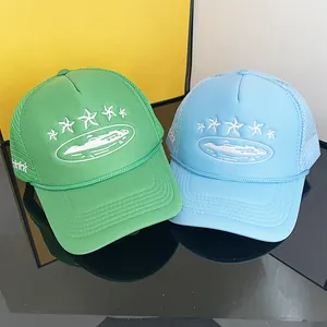 Breathable trucker hats in bright green and light blue with embroidered star designs