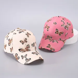 Detailed close-up of butterfly print fabric on a stylish cotton baseball cap